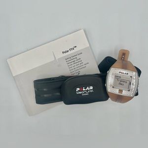 Women’s Polar FT4 watch and heart rate monitor. Copper/tan color. Fitness watch.